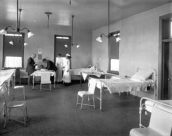 A physican examines a student in the Carlisle Indian School hospital. Undated, courtesy: Cumberland County Historial Society.