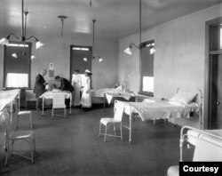 A physican examines a student in the Carlisle Indian School hospital. Undated, courtesy: Cumberland County Historial Society.