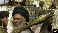 A Taliban fighter holds anti-tank rockets in Torkham, Afghanistan, on the border with Pakistan (file photo)