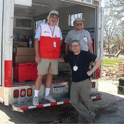 Josh Neufeld, center, takes a break with fellow Red Cross volunteers in Biloxi, Mississippi
