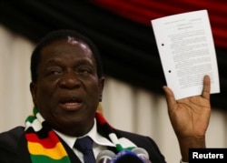 FILE - Zimbabwe President Emmerson Mnangagwa announces the date for the general elections in Harare, Zimbabwe, May 30, 2018.