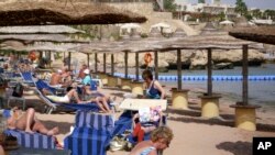 Tourists at the beach of the Red Sea tourist resort of Sharm el-Sheik, Egypt, Feb. 21, 2011. 