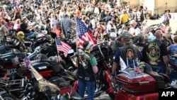 A crowd of motorcyclists is gathered at the Washington National Cathedral for the "Blessing of the Bikes," May 24, 2019, in Washington. The Rolling Thunder First Amendment Demonstration Run, a tradition since 1988, comes to an end this Memorial Day.