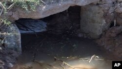 This April 25, 2015 photo, from the U.S. Border Patrol and introduced as evidence in U.S. District Court, shows the exit canal from a tunnel from Mexicali, Mexico that Border Patrol agents said was used by Evelio Padilla, a Honduran national, to smuggle m