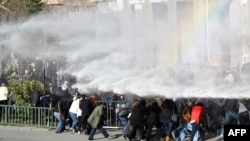 Turkish riot police use water cannon to disperse protesters outside the Supreme Electoral Council (YSK) in Ankara, April 1, 2014. 