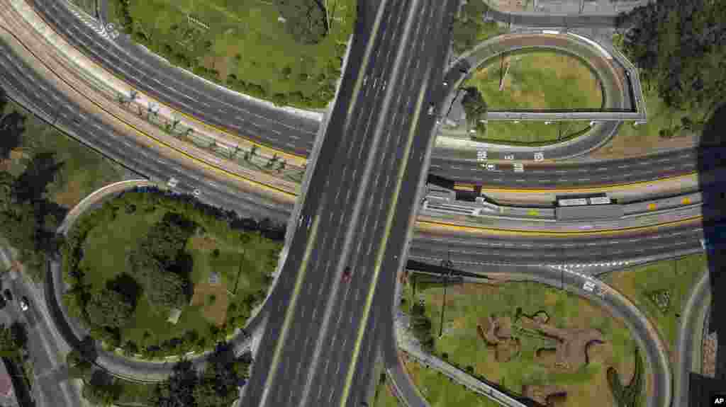 A highway exchange stands empty of traffic after the government implemented restrictions to prevent the spread of the new coronavirus in Lima, Peru, March 18, 2020.