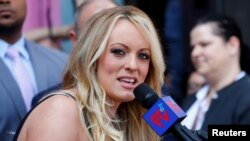 FILE - Adult film star Stormy Daniels speaks during a ceremony in her honor in West Hollywood, Calif., May 23, 2018.