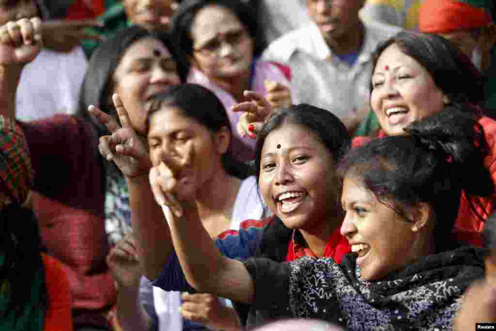 People celebrate after the Supreme Court rejected Abdul Quader Mollah's request for an appeal against his death sentence in Dhaka, Dec. 12, 2013. 