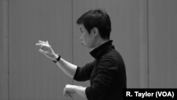 Conductor Chen Lin rehearses "Luan Tan" by composer Chen Qigang at The Juilliard School.