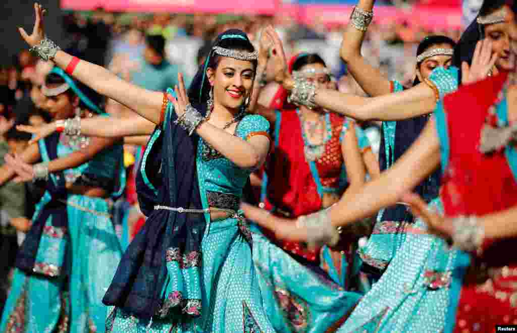 Dancers perform a traditional Indian dance during the Diwali festival of light celebrations, in Trafalgar Square, central London.