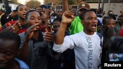 Miners celebrate their release from jail at Ga-Rankuwa Magistrate's Court, Pretoria, South Africa, Sept. 3, 2012. Workers that were arrested at Marikana were released after charges of murder and attempted murder were withdrawn.