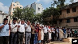 Bangladeshi Muslims attend the funeral of Xulhaz Mannan