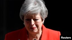 British Prime Minister Theresa May reacts as she announces her resignation in London, May 24, 2019.