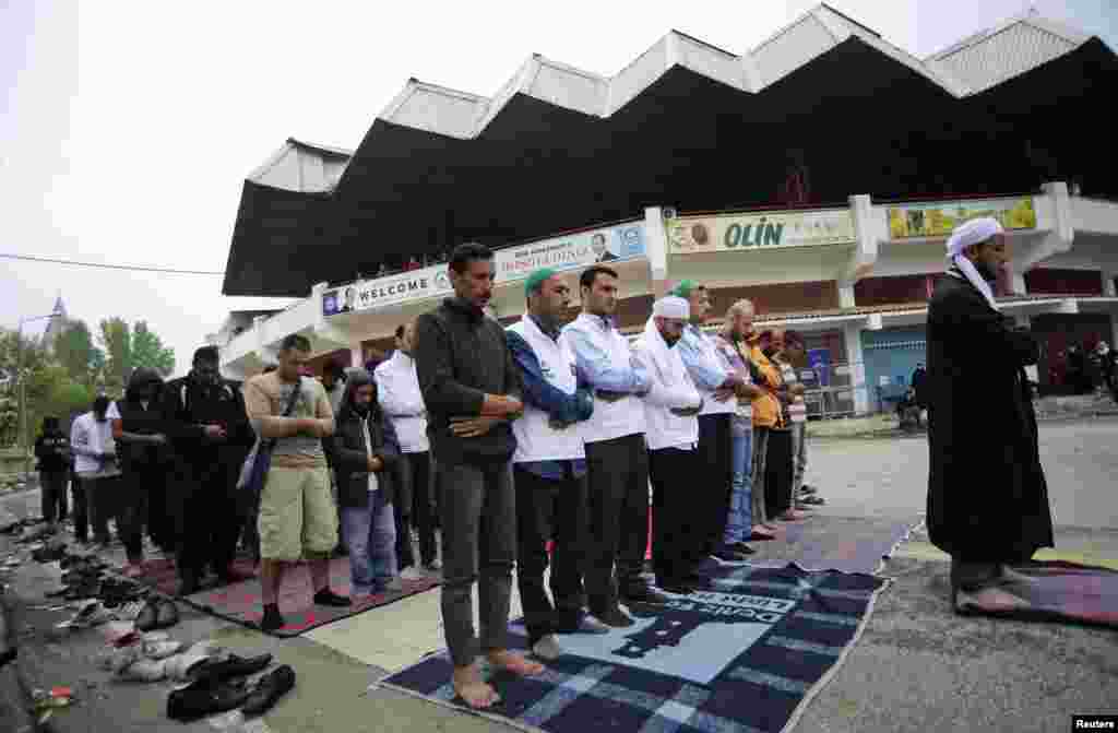 Syrian migrants offer Eid al-Adha prayers outside the Sarayici oil wrestling arena in Edirne, Turkey.&nbsp;EU leaders pledged at least 1 billion euros for Syrian refugees in the Middle East and closer cooperation to stem migrant flows into Europe at a summit described as less tense than feared after weeks of feuding.
