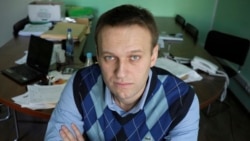 In this March 17, 2010 file photo, corporate Russian lawyer Alexei Navalny poses in his office in Moscow, Russia. (AP Photo/Alexander Zemlianichenko, file)