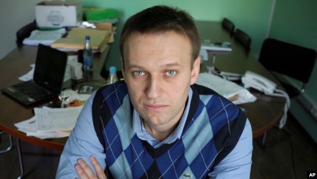 In this March 17, 2010 file photo, corporate Russian lawyer Alexei Navalny poses in his office in Moscow, Russia. (AP Photo/Alexander Zemlianichenko, file)