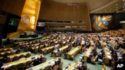 FILE - People gather at the General Assembly, prior to a vote, Dec. 21, 2017, at United Nations headquarters in New York.