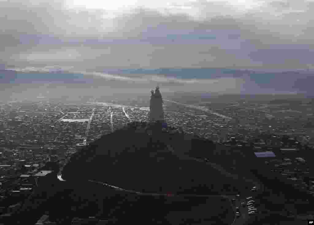 A large statue of the Virgin Mary, unveiled Friday, stands on Santa Barbara hill overlooking the mining city of Oruro, Bolivia. &quot;Virgen del Socav&oacute;n&quot; is Oruro&#39;s patron and venerated in particular by miners. The statue stands at 45 meters (147 feet).