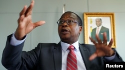Finance Minister Mthuli Ncube gestures during a media briefing in Harare, Zimbabwe, Oct. 5, 2018. 