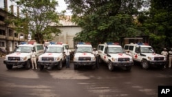 FILE - Five ambulances that were donated by the U.S. to help combat the Ebola virus are lined up following a ceremony attended by Sierra Leone's president Ernest Bai Koroma, in Freetown, Sierra Leone, Sept. 10, 2014. 