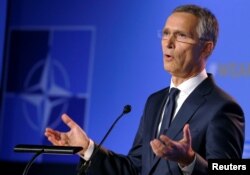 NATO Secretary-General Jens Stoltenberg gestures as he holds a news conference during the NATO summit in Brussels, Belgium, July 11, 2018.