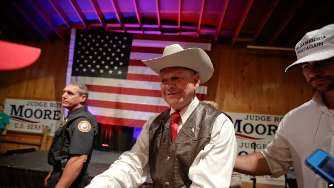 Former Alabama chief justice and U.S. Senate candidate Roy Moore shakes hands with supporters in Fairhope, Alabama, Sept. 25, 2017.
