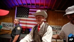 Former Alabama chief justice and U.S. Senate candidate Roy Moore shakes hands with supporters in Fairhope, Alabama, Sept. 25, 2017.