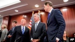 From left, House Ways and Means Committee Chairman Kevin Brady, R-Texas, Rep. Richard Neal, D-Mass., ranking member of the House Ways and Means Committee, and Sen. Ron Wyden, D-Ore., the top Democrat on the Senate Finance Committee, gather after GOP leaders announced they have forged an agreement on a sweeping overhaul of the nation's tax laws.