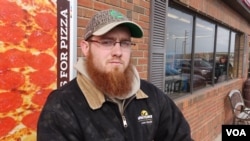 Dustin Andrews of Donnellson, Iowa, and many other young people like him who would like to farm for a living have had to look elsewhere for a career. The economics are against them, with land prices high and all other aspects of modern farming expensive as well. (G. Flakus/VOA)