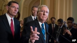 Senate Majority Leader Mitch McConnell of Ky., joined by, from left, Sen. John Barrasso, R-Wyo., and Sen. John Thune, R-S.D., meets with reporters July 11, 2017, on Capitol Hill in Washington. 