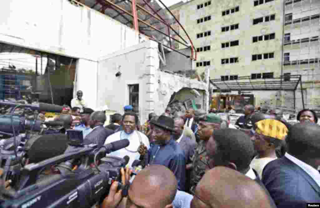 Nigeria's President Goodluck Jonathan speaks to the media during a visit to This Day newspaper in Abuja April 28, 2012. Suicide car bombers targeted the offices of Nigerian newspaper This Day in the capital Abuja and northern city of Kaduna on Thursday, k