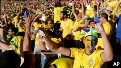 Brazil soccer fans celebrate their team's victory over Chile after a penalty shootout at a World Cup round of 16 match, Mineirao Stadium, Belo Horizonte, June 28, 2014.