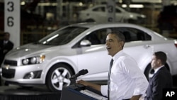 President Barack Obama speaks at the General Motors Orion assembly plant in Orion Township, Michigan, October 14, 2011.