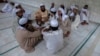 FILE - Pakistani religious students and teachers attend a discussion session at the Ganj Madrassa in Peshawar, Aug. 21, 2013.