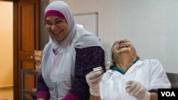 These Lebanese women are from two religious communities (the Bab Al-Tebbeneh and Jabal Mohsen) and should be enemies. But don't tell them that. They are too busy making money for their families, peace for their communities and just having fun together, December 2014. (J. Owens / VOA)