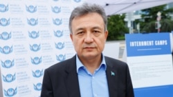Dolkun Isa, President of the World Uyghur Congress, poses at a United States-backed Uyghur photo exhibit of dozens of people who are missing or alleged to be held in Chinese-run camps in Xinjiang, China in front of the U.N. in Geneva, Switzerland, Sept. 1