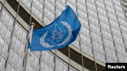 FILE - The flag of the International Atomic Energy Agency (IAEA) flies in front of its headquarters in Vienna, Austria, Jan.15, 2016. 