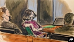 In this courtroom sketch, Ghislaine Maxwell, center, sits in the courtroom during a discussion about a note from the jury, during her trial, in New York, Dec. 29, 2021.