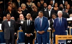 From left, Louis Farrakhan, the Rev. Al Sharpton, the Rev. Jesse Jackson and former President Bill Clinton attend the funeral of Aretha Franklin at Greater Grace Temple, Aug. 31, 2018, in Detroit.