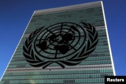 FILE - The United Nations logo is pictured in front of the United Nations Headquarters building during the 71st United Nations General Assembly in the Manhattan borough of New York.