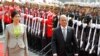 Burma President Thein Sein (R) and Thai Prime Minister Yingluck Shinawatra (L) review the honor guard during a welcoming ceremony in Bangkok, July 23, 2012.