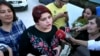 FILE - Khadija Ismayilova, then a reporter for Radio Free Europe/Radio Liberty, speaks to journalists after her release from prison in Baku, Azerbaijan, May 25, 2016. 
