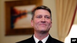 FILE - In this April 16, 2018 file photo, U.S. Navy Rear Adm. Ronny Jackson, M.D., is shown before a meeting with Sen. Johnny Isakson, R-Ga., chairman of the Veteran's Affairs Committee, on Capitol Hill, in Washington. 