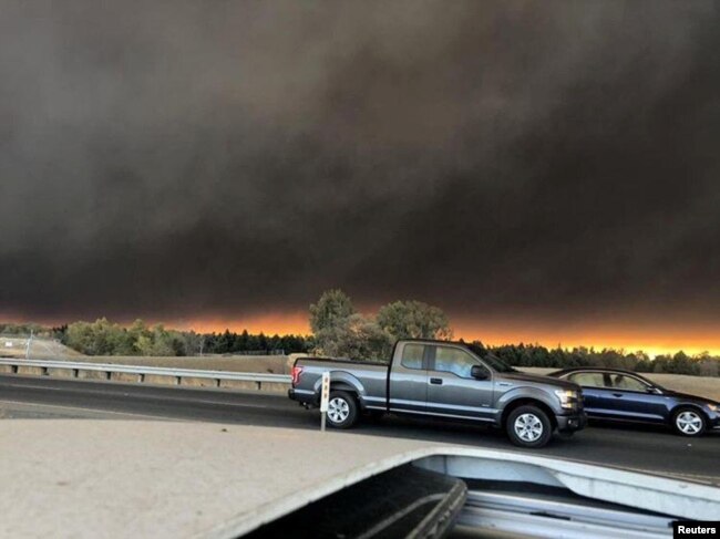 Vehicles are seen during evacuation from Paradise to Chico, in Butte County, California, in this Nov. 8, 2018, picture obtained from social media.