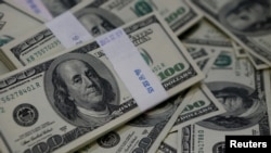 The U.S. dollar traded higher against most other currencies in December.