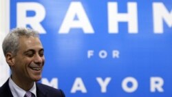 Rahm Emanuel smiles as he talks to his supporters and volunteers at his campaign office in Chicago