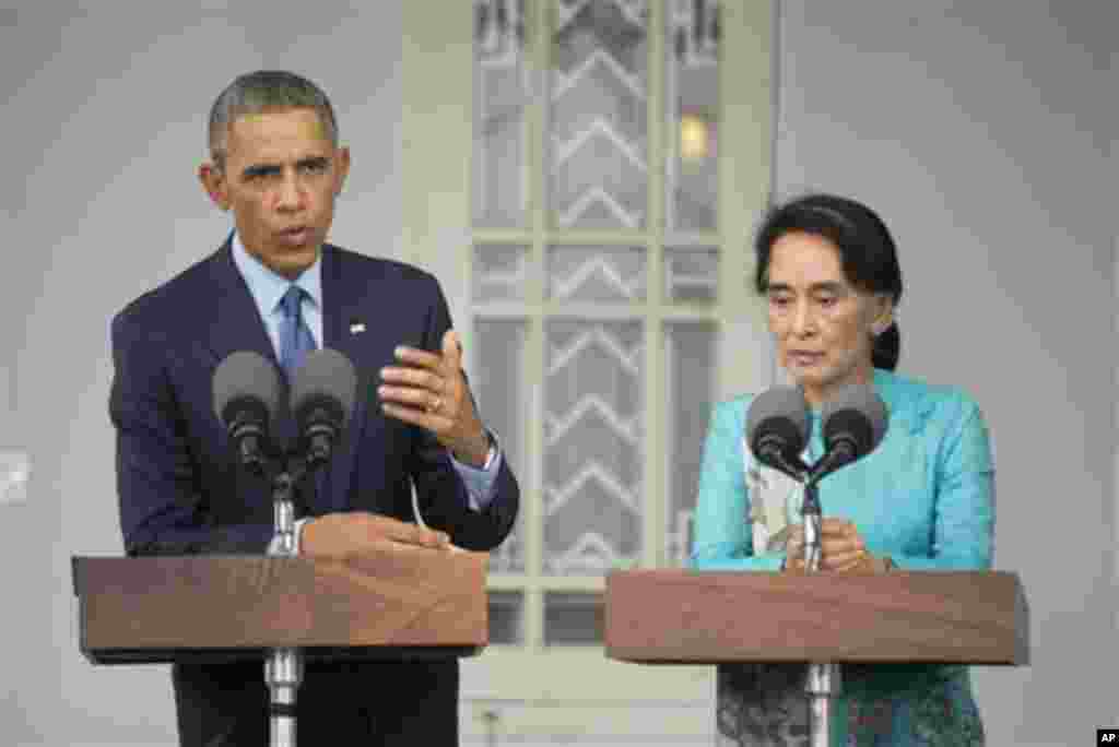 U.S. President Barack Obama, left, with Myanmar's opposition leader Aung San Suu Kyi hold their joint news conference at her home in Yangon, Myanmar Friday, Nov. 14, 2014.