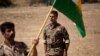 FILE - A commander instructs new recruits of the Democratic Party of Iranian Kurdistan during training at their base in Koya, northern Iraq, Sept. 21, 2016. 