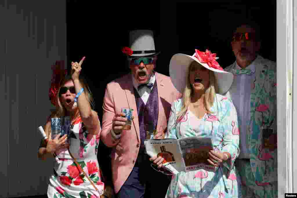 Spectators cheer for their winning horse at Churchill Downs on the day of the 147th Kentucky Derby in Louisville, Kentucky, May 1, 2021.