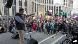 FILE - Russian opposition leader Alexei Navalny speaks during a rally against authorities' move to block parts of the internet in Russia, April 30, 2018. 